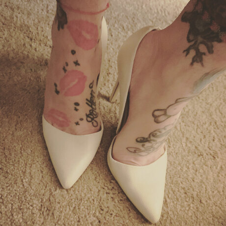 Tattooed Tootsie pornstar sex image